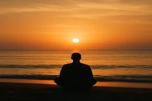 Une personne assise face au lever du soleil, symbolisant le calme retrouvé après une période de stress ou de surcharge mentale. Cette image illustre le retour à l’équilibre intérieur favorisé par le Neurofeedback Thérapeutique Cygnet.